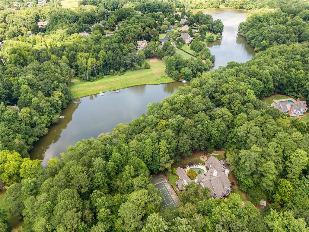 1940 Dinsmore Road Milton, GA 30004 - Photo 5 of 71 an aerial view of a house with a yard and lake view