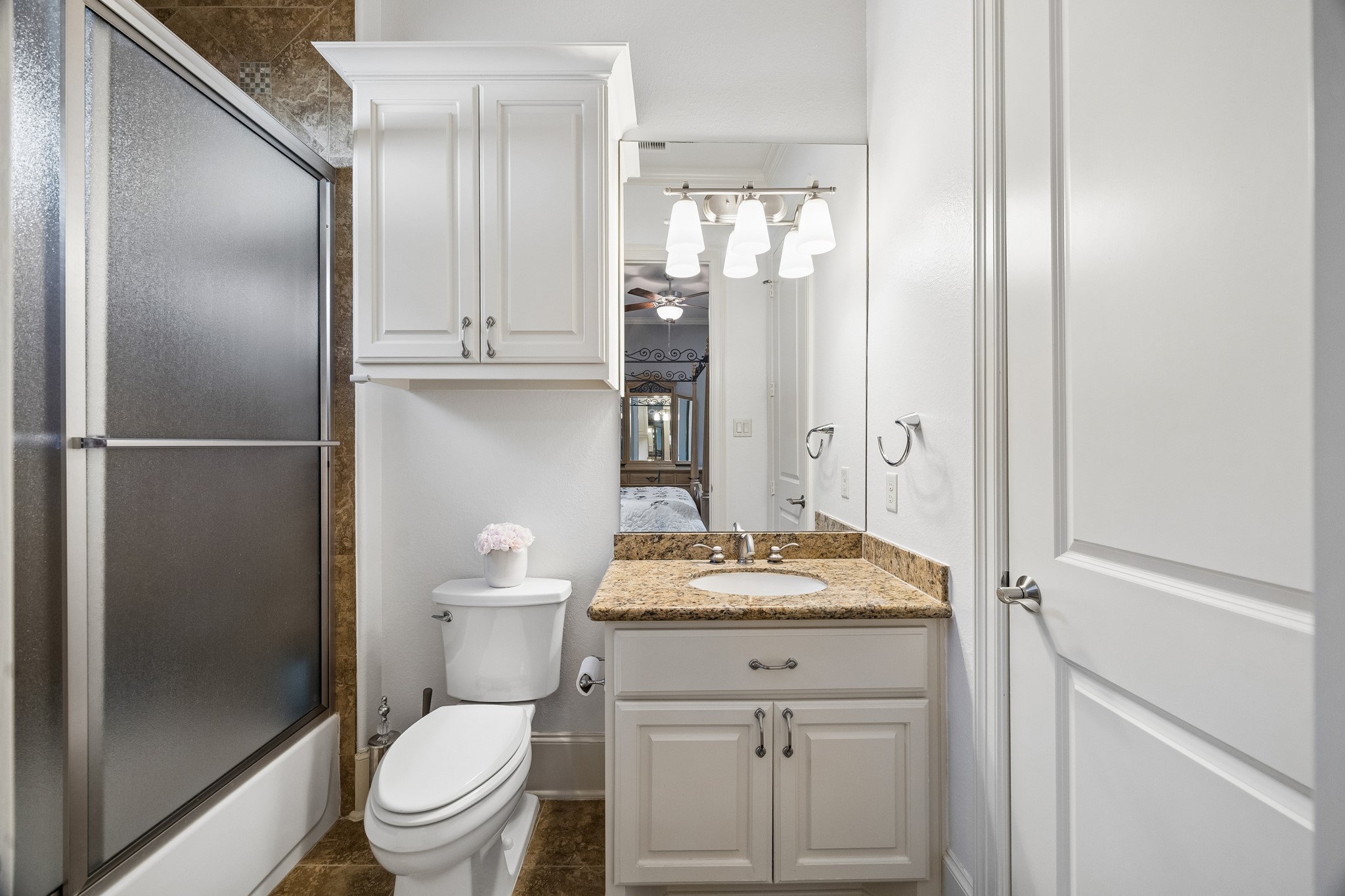 3914 Louvre Lane Houston, TX 77082 - Photo 26 of 31 a bathroom with a granite countertop sink toilet and shower
