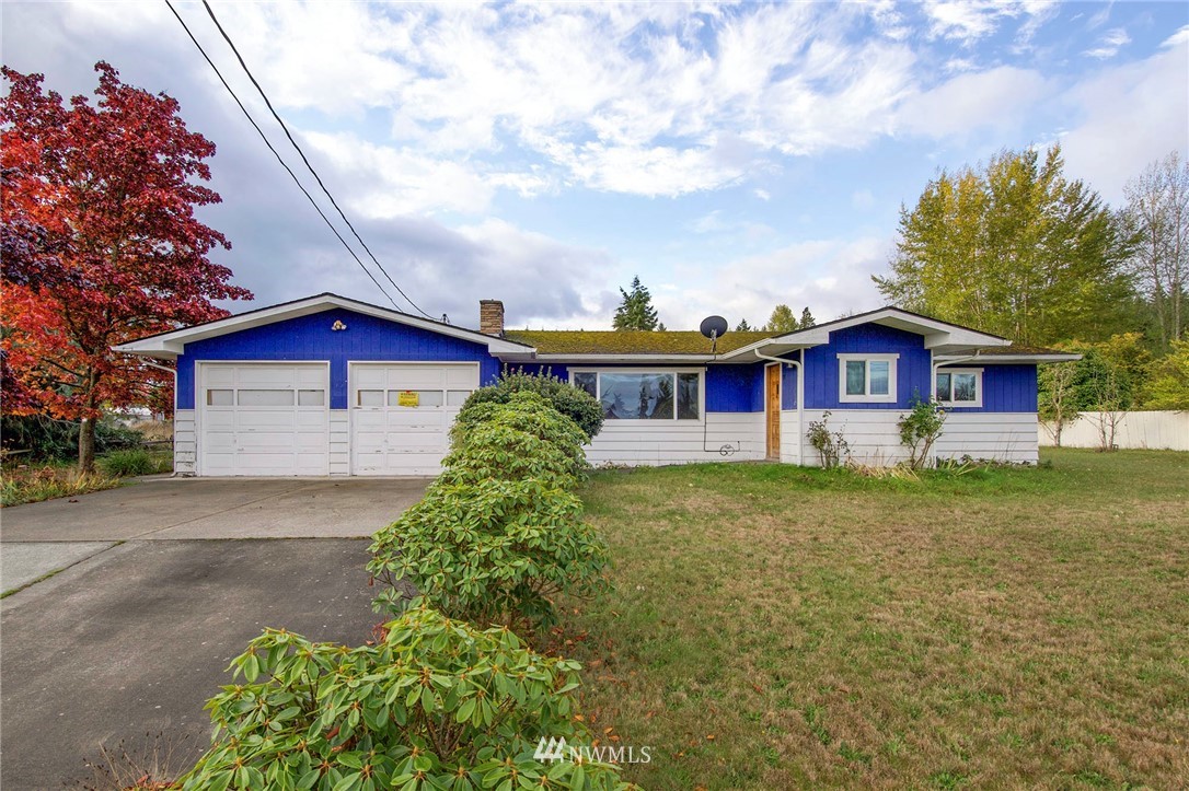 190 Roupe Road Sequim, WA 98382 - Photo 1 of 20 a front view of a house with garden