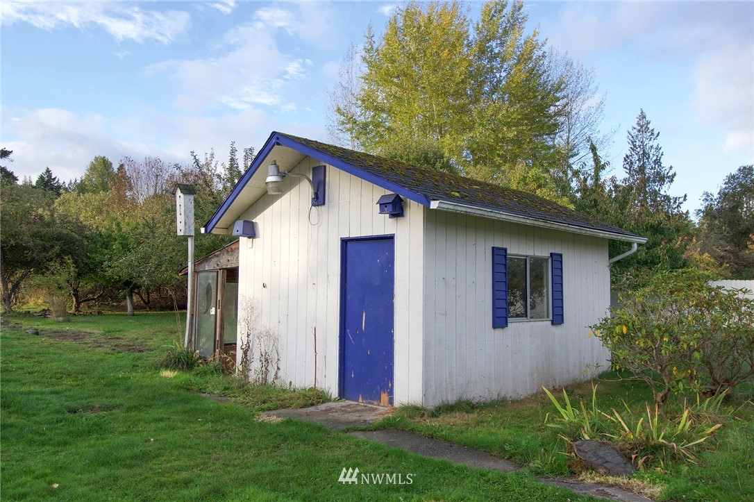 190 Roupe Road Sequim, WA 98382 - Photo 14 of 20 a front view of house with yard and trees all around
