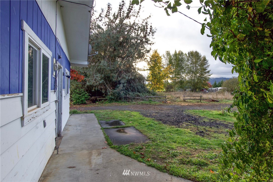 190 Roupe Road Sequim, WA 98382 - Photo 20 of 20 a view of a pathway of a house with yard and tree s