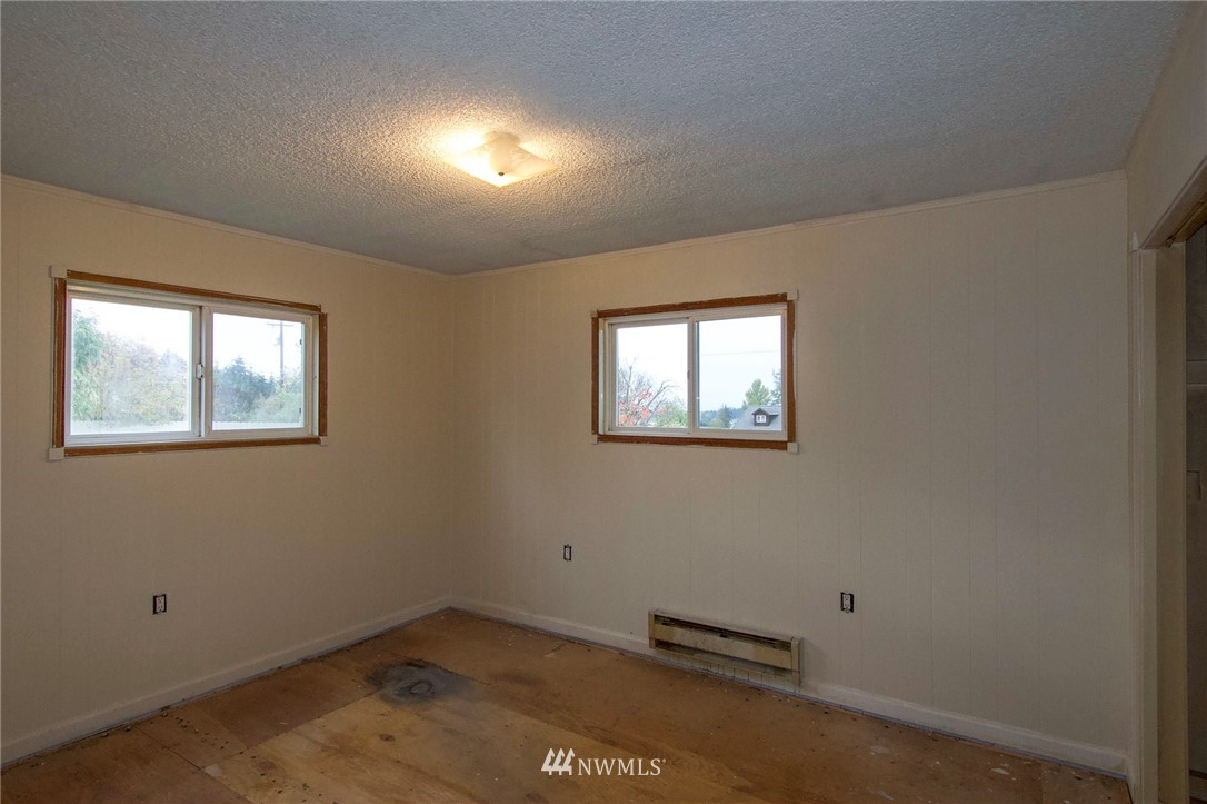 190 Roupe Road Sequim, WA 98382 - Photo 9 of 20 an empty room with windows