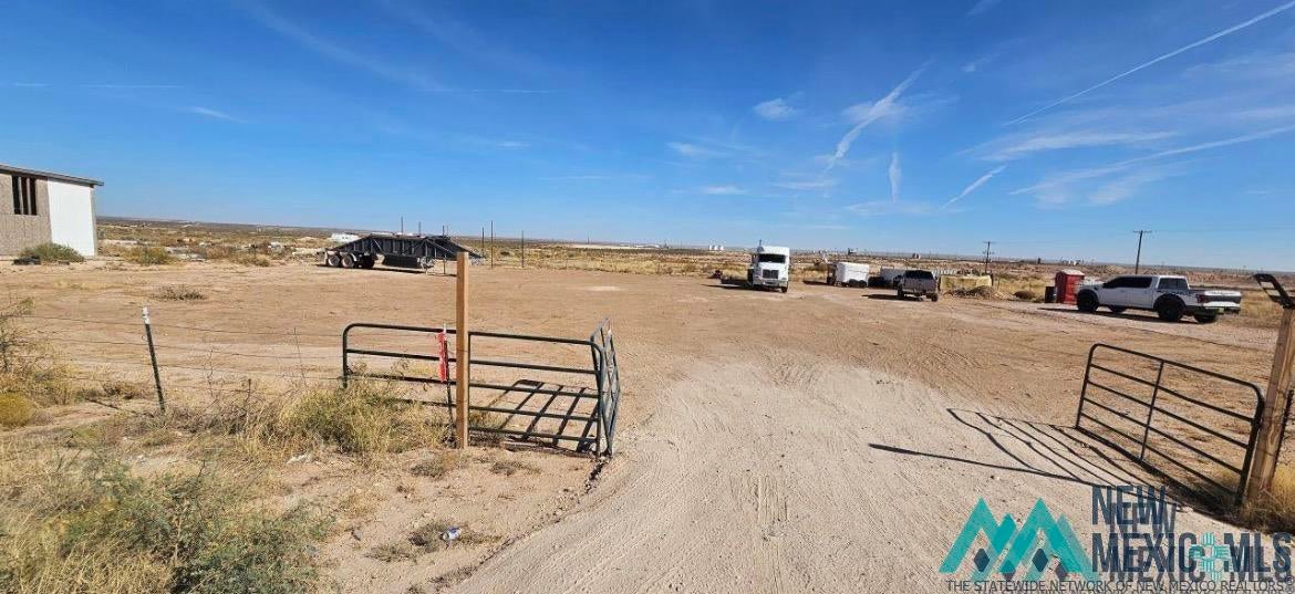 36 South Donaldson Farm Road Loving, NM 88256 - Photo 1 of 1 View of yard with a view of countryside and a gate