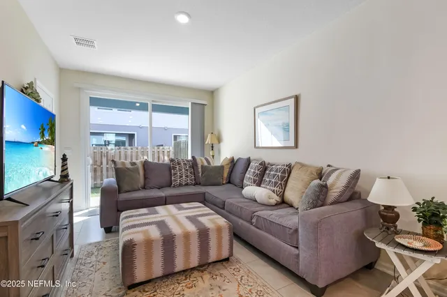 a living room with furniture and a couch