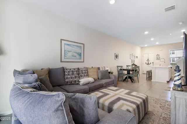a living room with furniture and a table