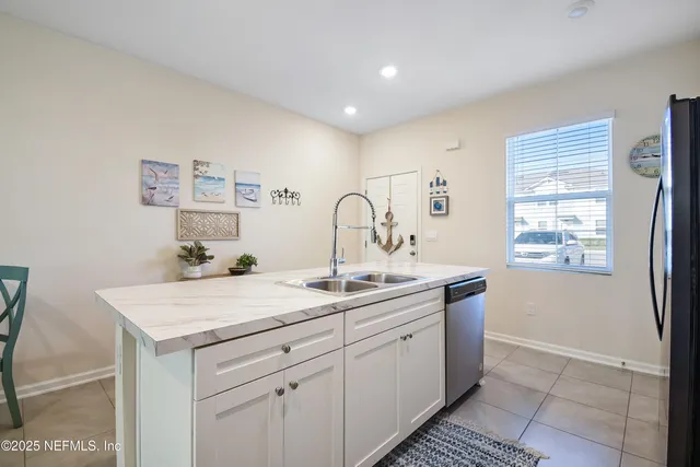 a kitchen with a sink and cabinets