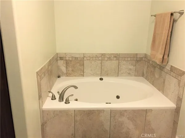 a bathroom with bathtub and shower