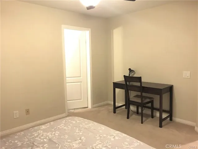 a workspace with furniture and a window