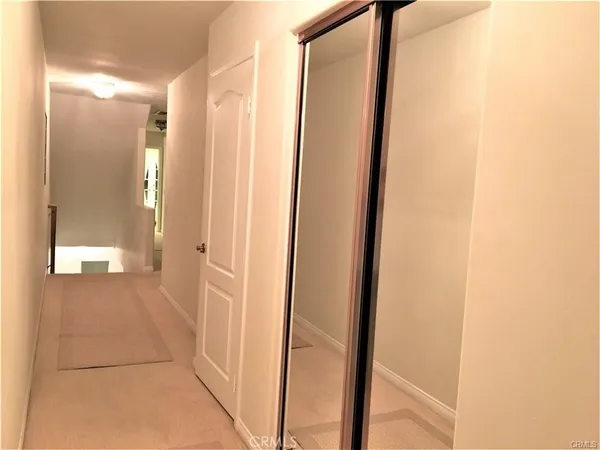 a view of a bathroom from a hallway