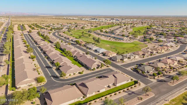 an aerial view of a residential building and city view
