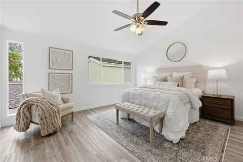 a bedroom with a bed and window