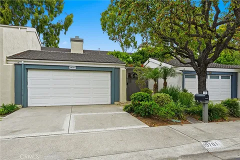 a house with a tree in front of it