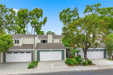 front view of a house with a tree