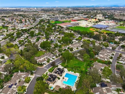 an aerial view of a house with a yard basket ball court and outdoor seating