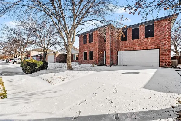 a view of a house with a snow in the yard