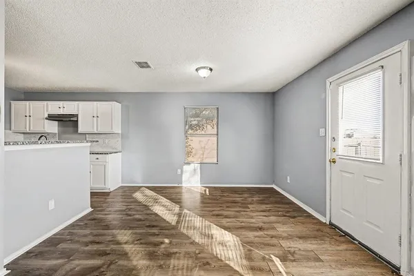 a view of a kitchen with a sink cabinets and a window