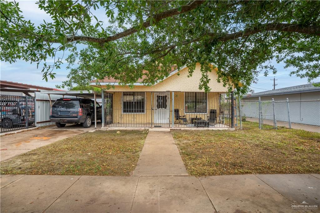 613 South 12th Street McAllen, TX 78501 - Photo 1 of 15 front view of a house with a patio