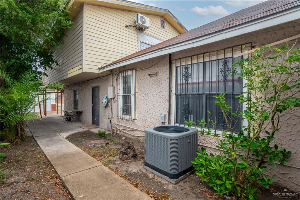 613 South 12th Street McAllen, TX 78501 - Photo 3 of 15 a view of a porch with plants and chairs