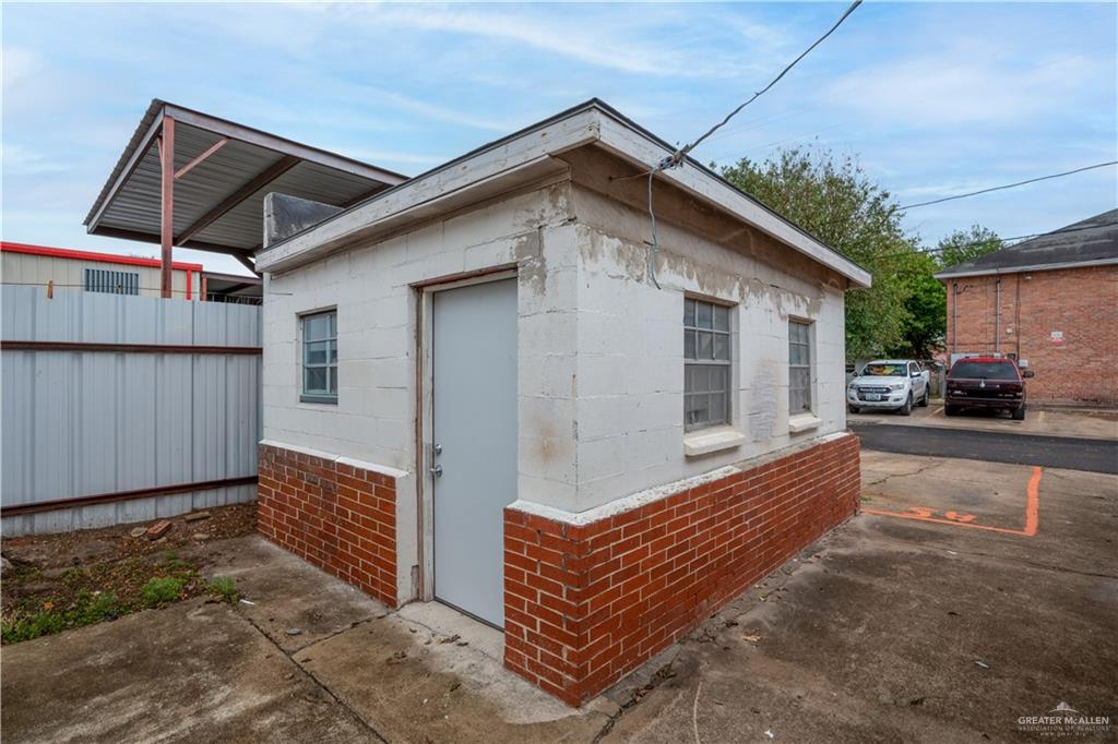 613 South 12th Street McAllen, TX 78501 - Photo 5 of 15 a view of a wooden house with a yard