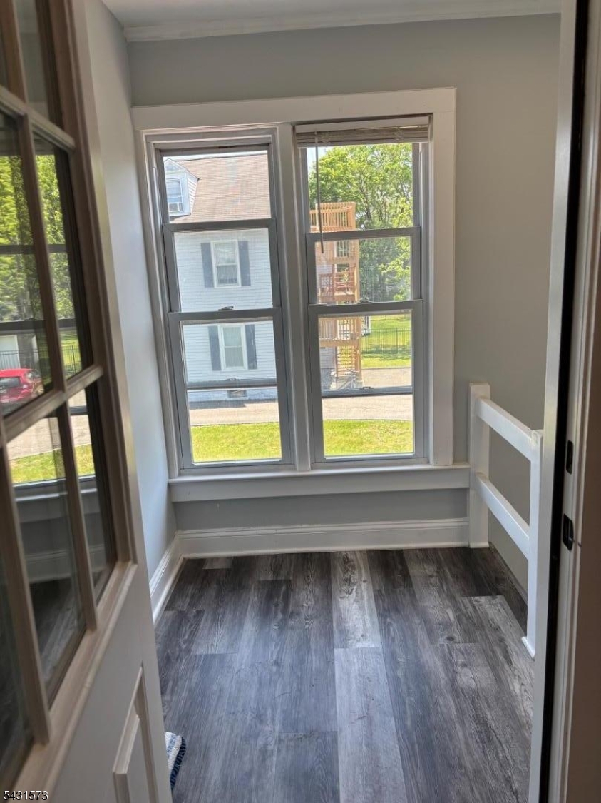 358 Woodland Road, Unit 2 Madison, NJ 07940 - Photo 34 of 50 a view of an empty room with wooden floor and a window