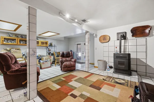 a living room with furniture and stairs