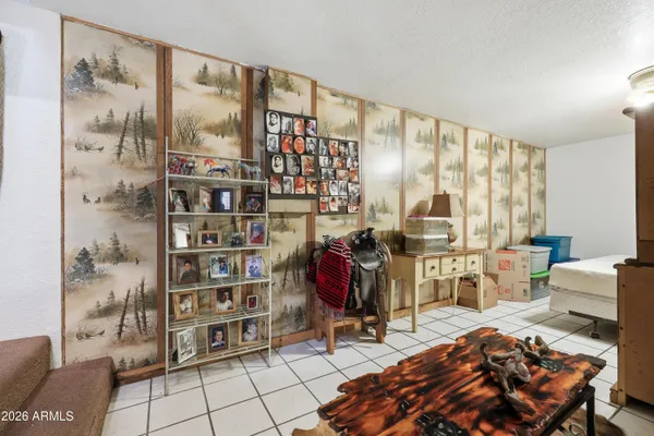 a living room with furniture and a stove top oven
