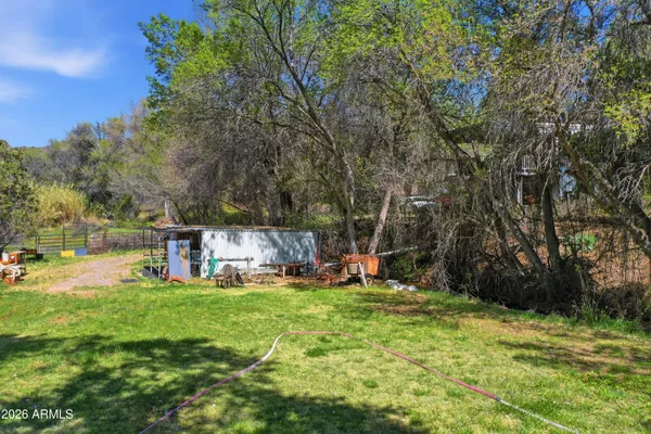 a backyard of a house with lots of green space