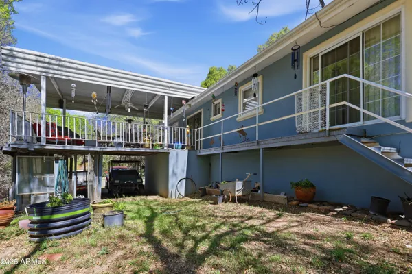 a view of a chair and tables in the balcony
