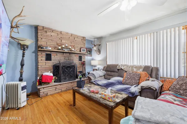 a living room with furniture fireplace and flat screen tv