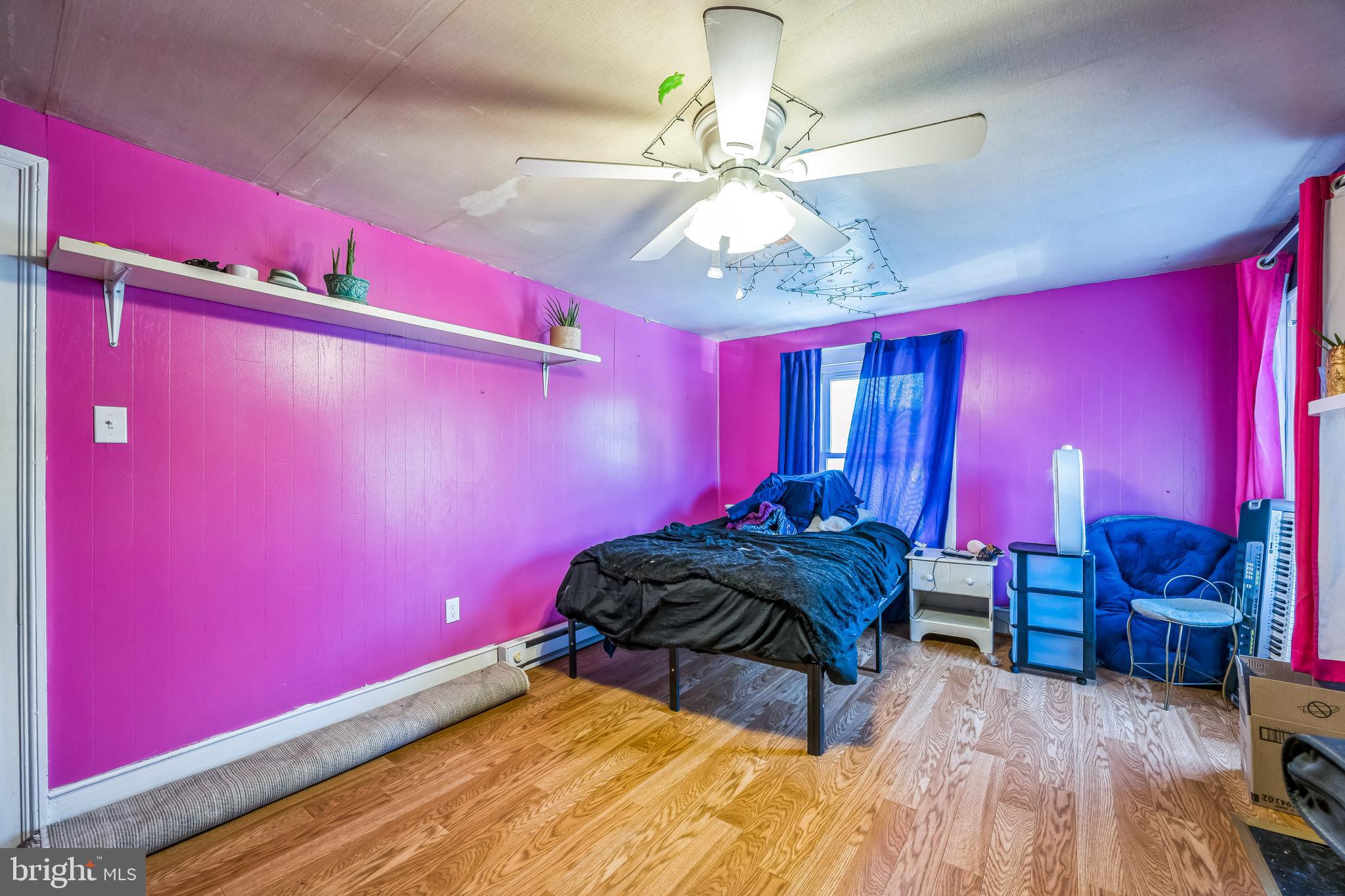 221 Kite Hollow Road Stanley, VA 22851 - Photo 27 of 33 Vibrant pink bedroom with modern accents.