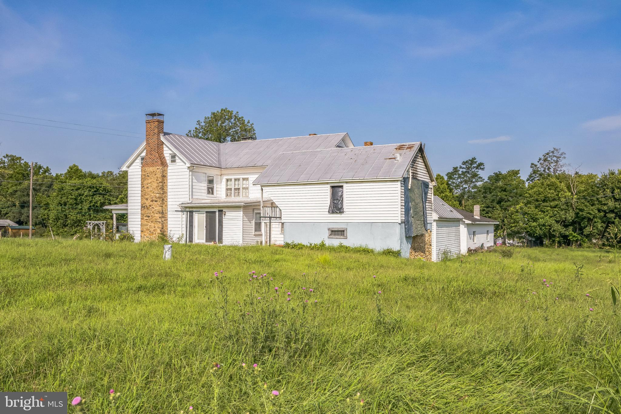 221 Kite Hollow Road Stanley, VA 22851 - Photo 3 of 33 Charming vintage home amidst lush greenery.