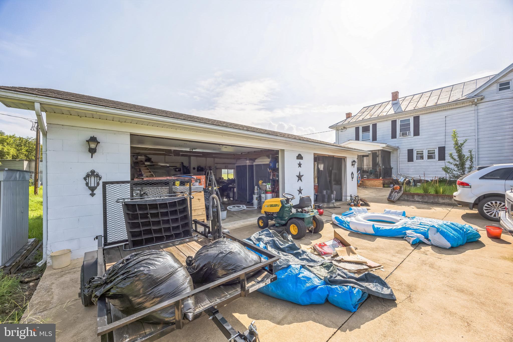 221 Kite Hollow Road Stanley, VA 22851 - Photo 4 of 33 Cluttered garage brimming with potential.
