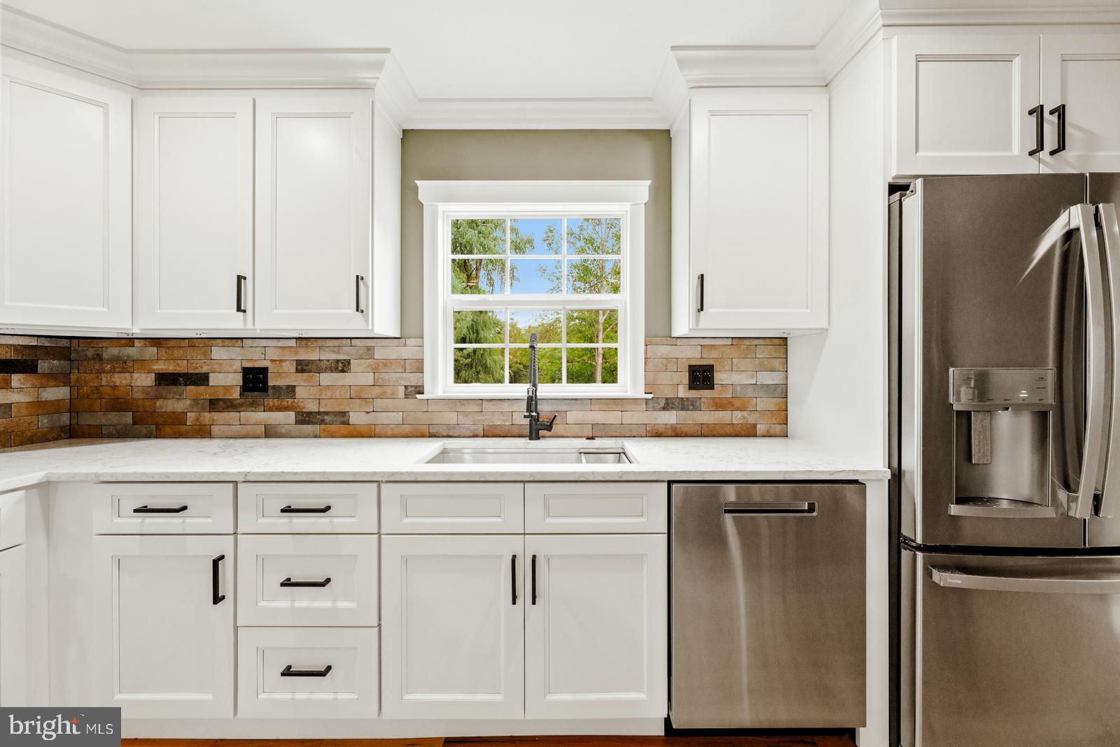 4448 Lower Mountain Road New Hope, PA 18938 - Photo 14 of 49 a kitchen with cabinets appliances and a window