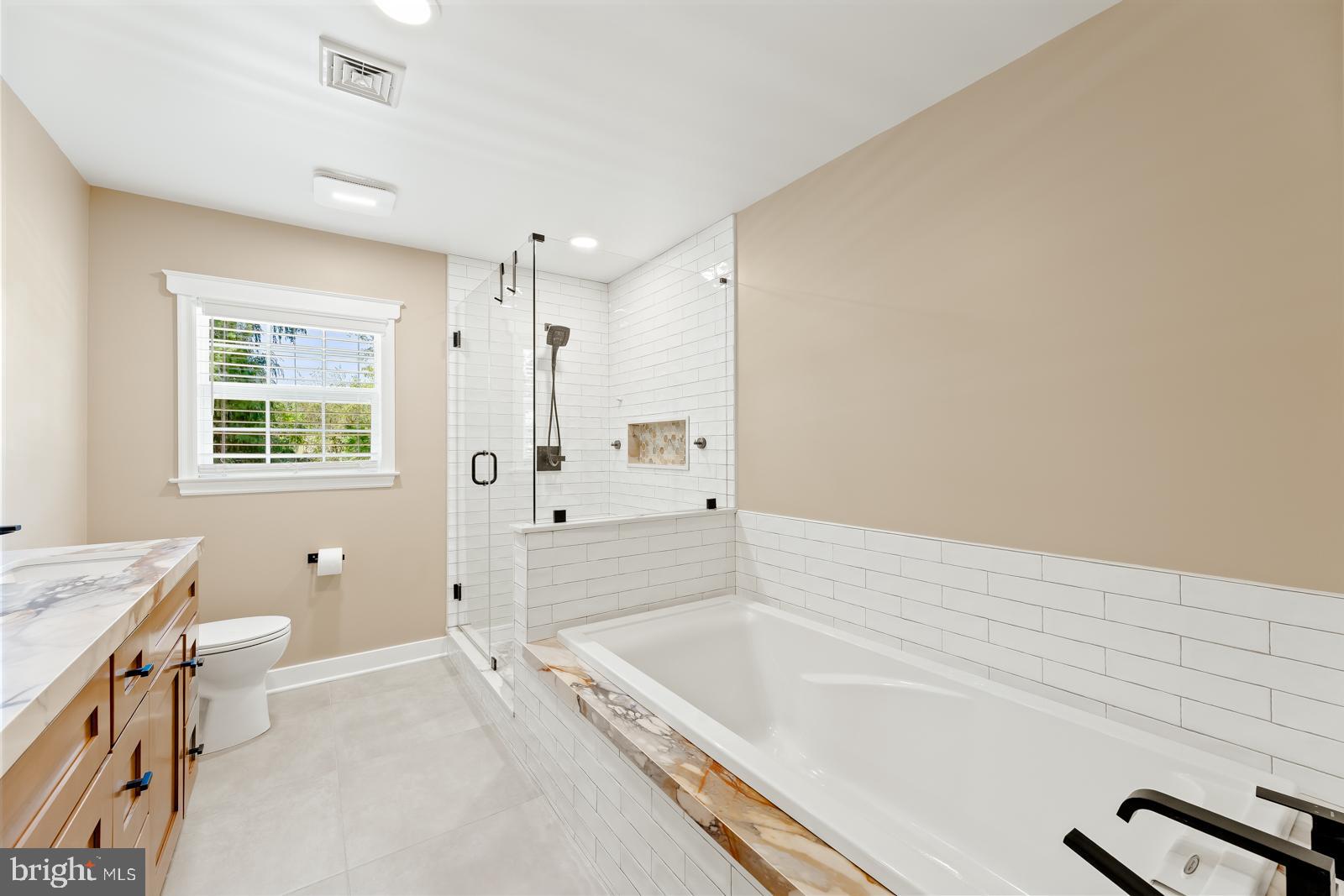 4448 Lower Mountain Road New Hope, PA 18938 - Photo 27 of 49 a spacious bathroom with a tub sink and mirror