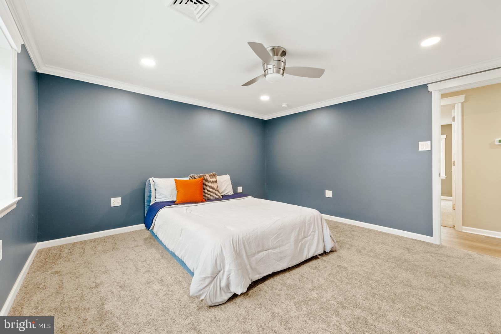 4448 Lower Mountain Road New Hope, PA 18938 - Photo 31 of 49 a bedroom with a large bed and a chandelier