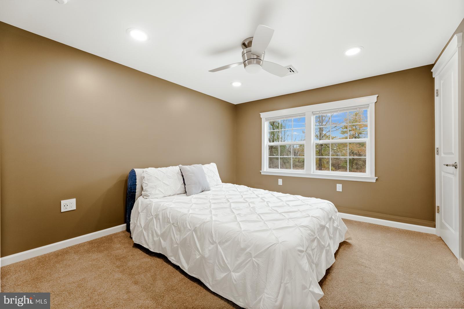 4448 Lower Mountain Road New Hope, PA 18938 - Photo 33 of 49 a large bed sitting in a room next to a window