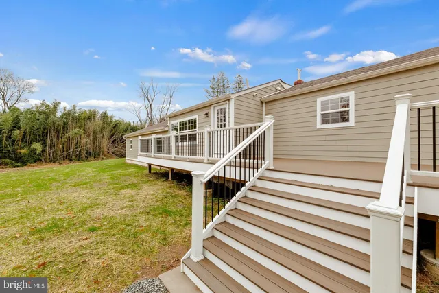 a view of a house with wooden stairs