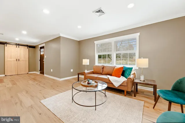 a living room with furniture and a window