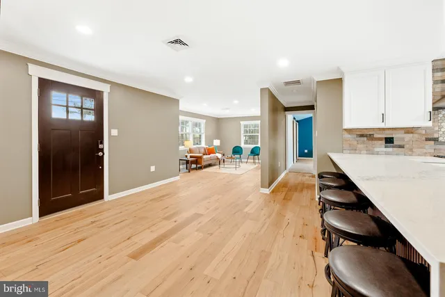 a view of kitchen with sink and window