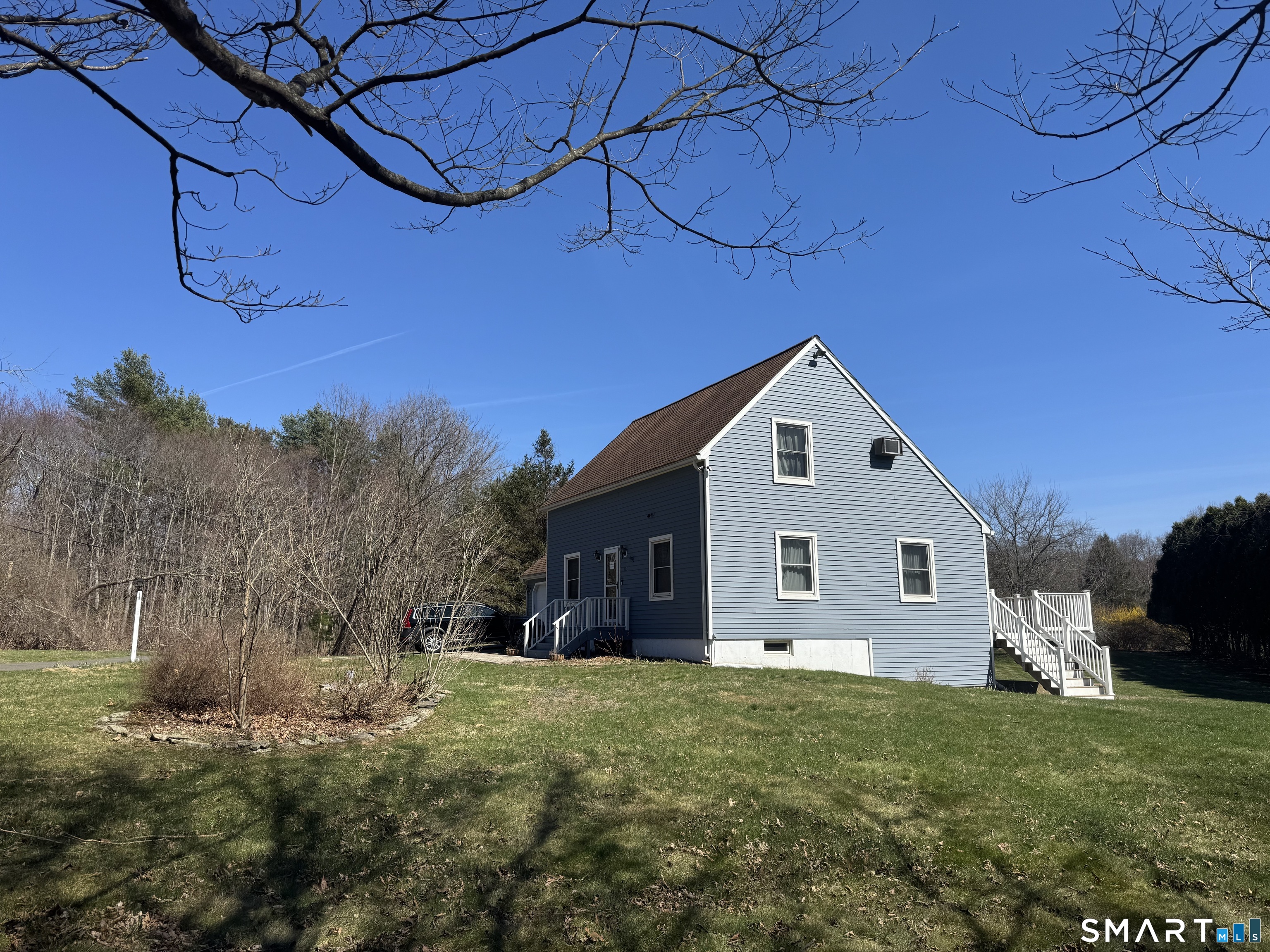 103 Birch Road Mansfield, CT 06268 - Photo 3 of 46 a view of a house with a yard