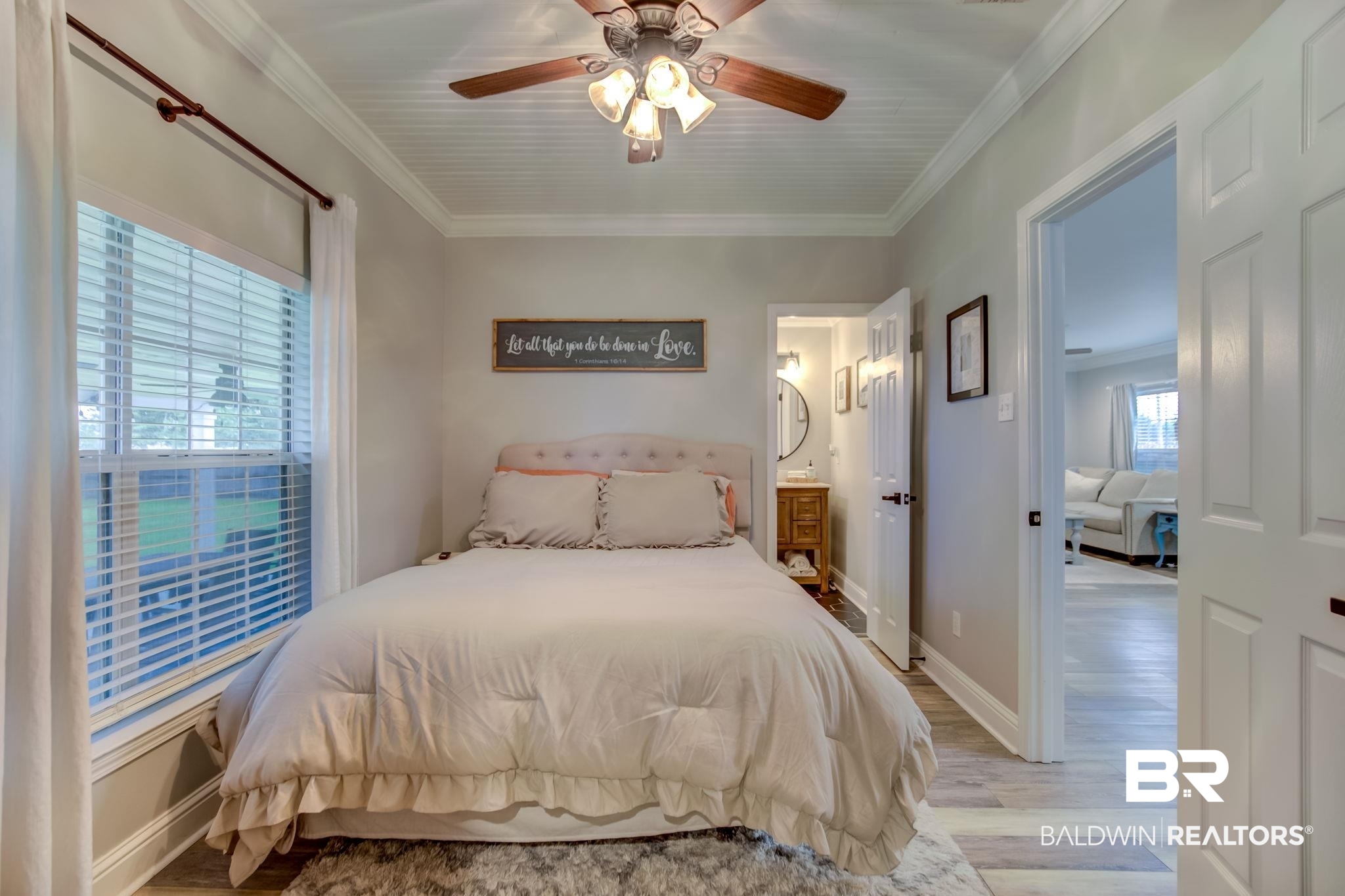 18732 Fairground Road Robertsdale, AL 36567 - Photo 23 of 46 Bedroom with light hardwood / wood-style floors, ornamental molding, ensuite bath, and ceiling fan