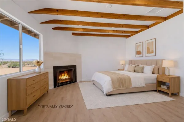 a view of empty room with a fireplace