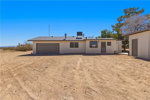 a view of a backyard of a house