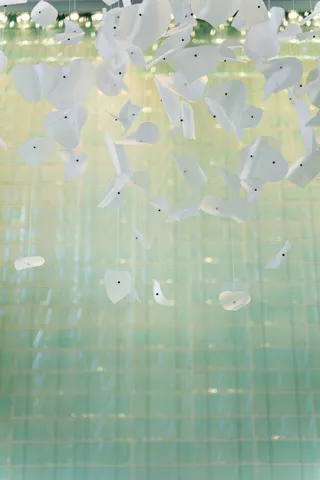 a dining room with a wooden table and chairs