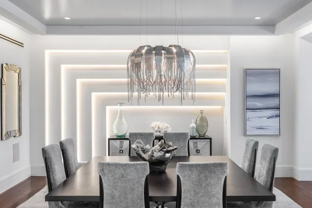 a spacious bedroom with a bed and large windows