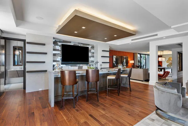 a view of a house with swimming pool and sitting area