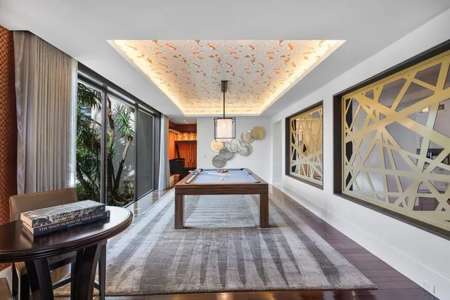 a view of sitting area with furniture and wooden floor