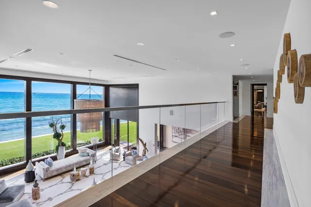 a view of a pool with a table and chairs