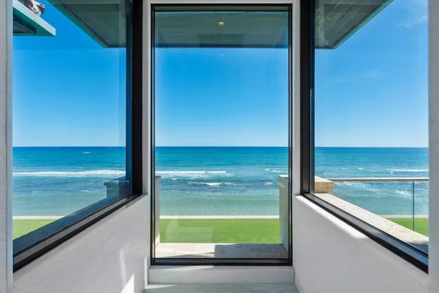 a view of a lake with boats and trees in the background