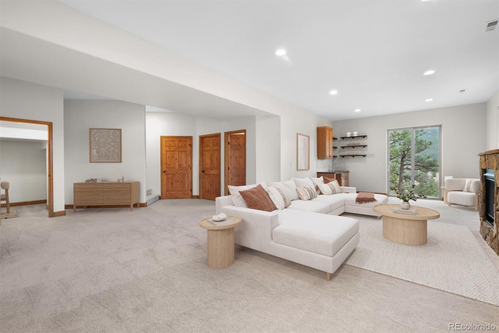 3191 Bittersweet Lane Evergreen, CO 80439 - Photo 23 of 40 a spacious bedroom with a bed and a large window